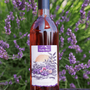 bottle of Peachy Blues with lavender in background