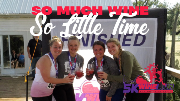 4 women toasting with witn glasses at the finish of the 5K race