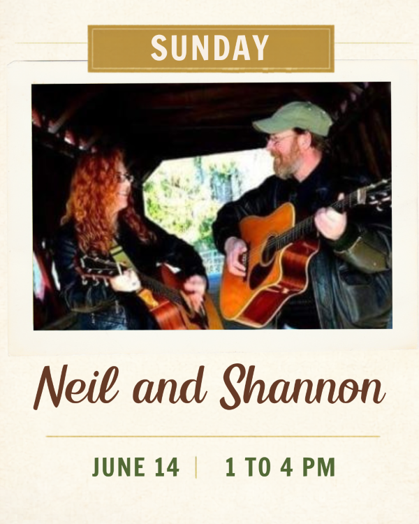 a woman and man with guitars facing each other