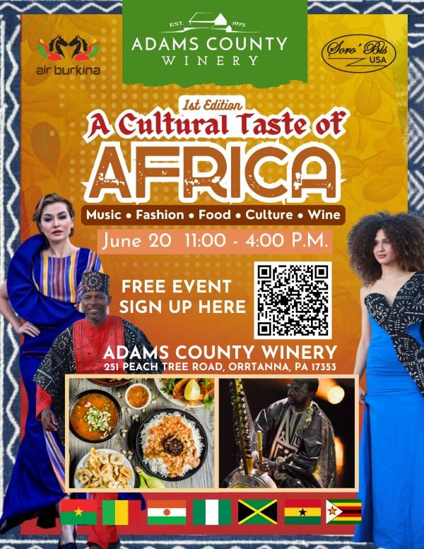 Two women in African fashion, a man playing Kora and African food pictured