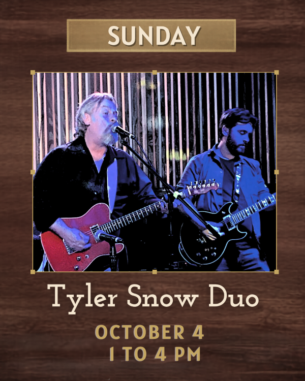 An older man and a younger guy on guitars singing