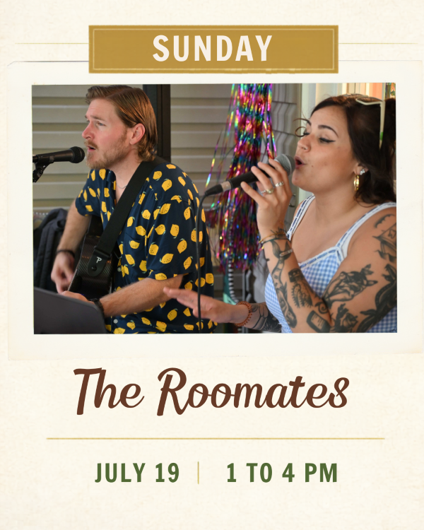 A woman with tattoos singing and a man on guitar
